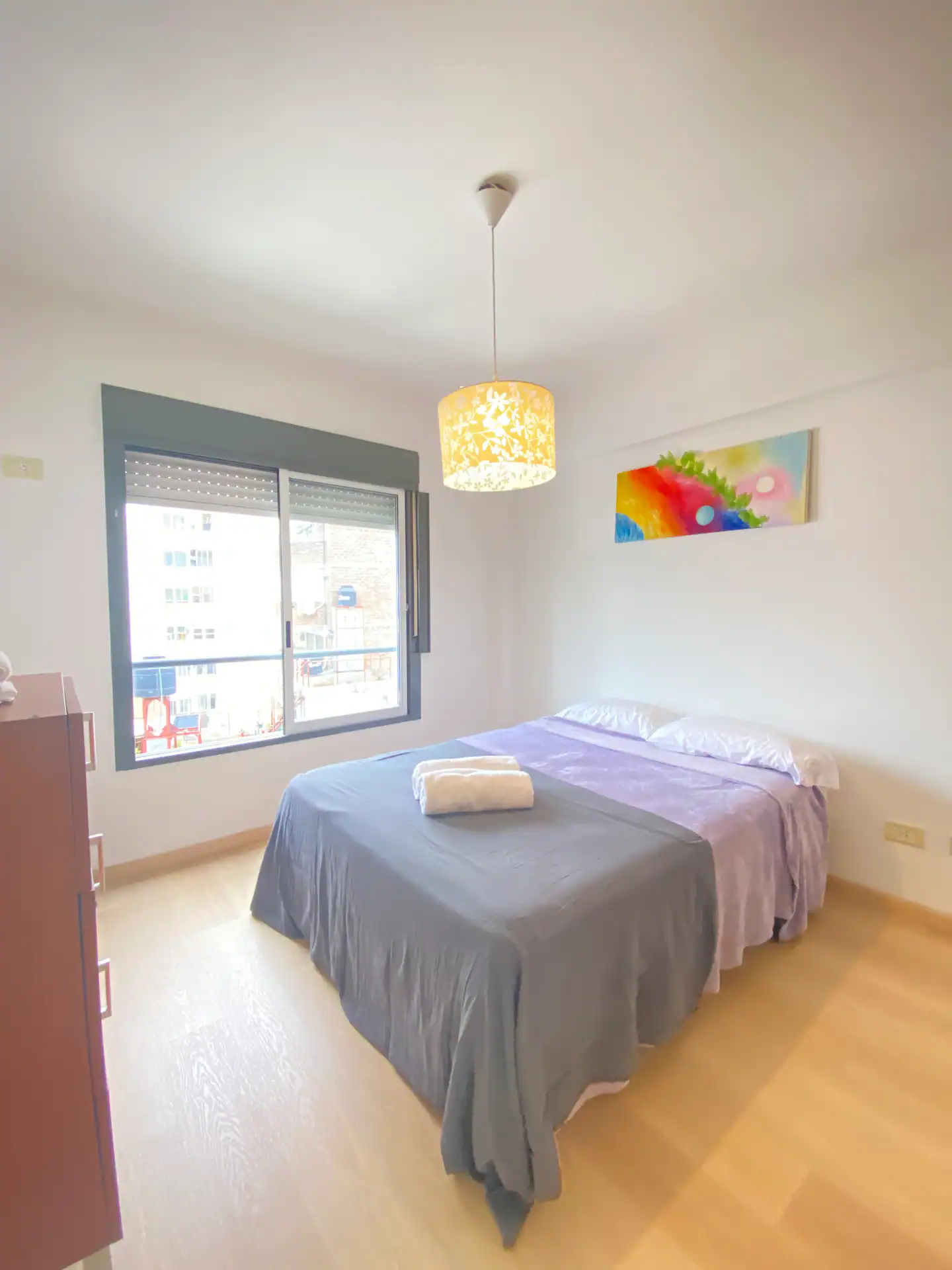 Bedroom with a double bed and window in the two-bedroom Palermo Soho apartment.