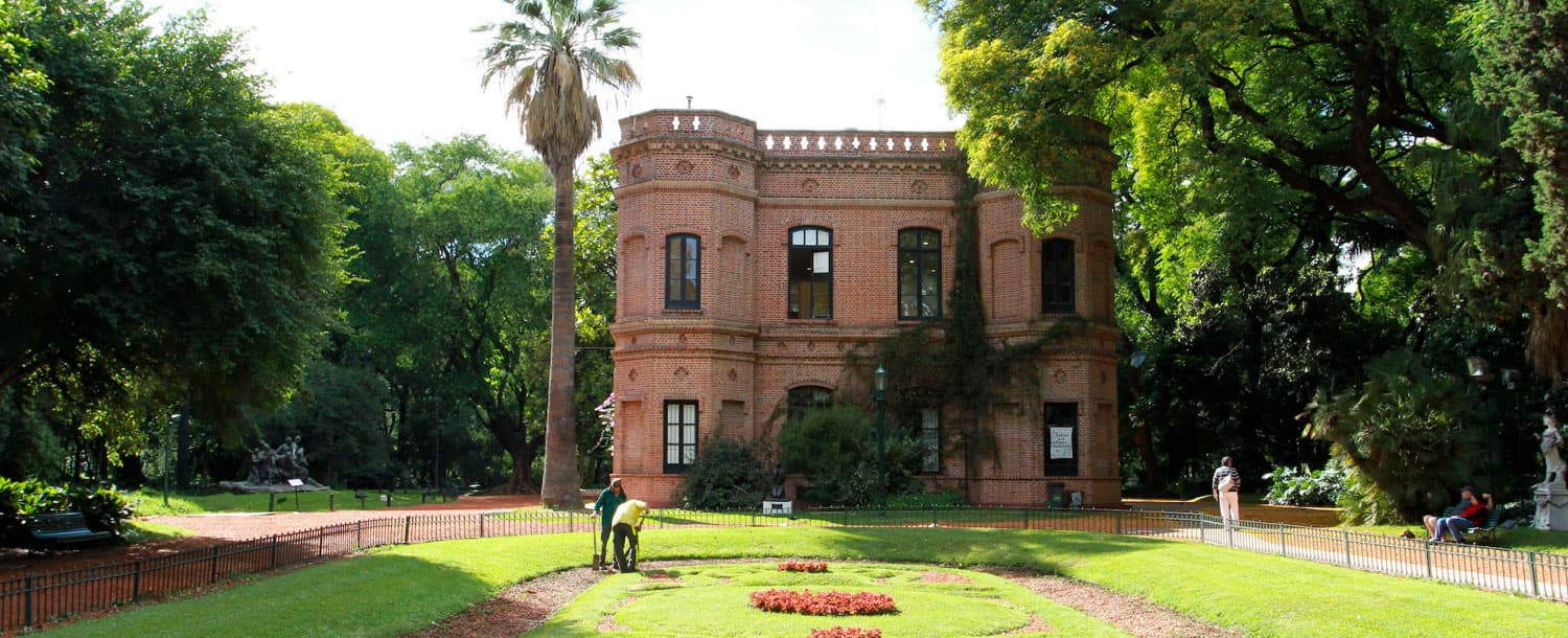 The brick building, lawns and trees at the Carlos Thays Botanical Garden in Palermo.
